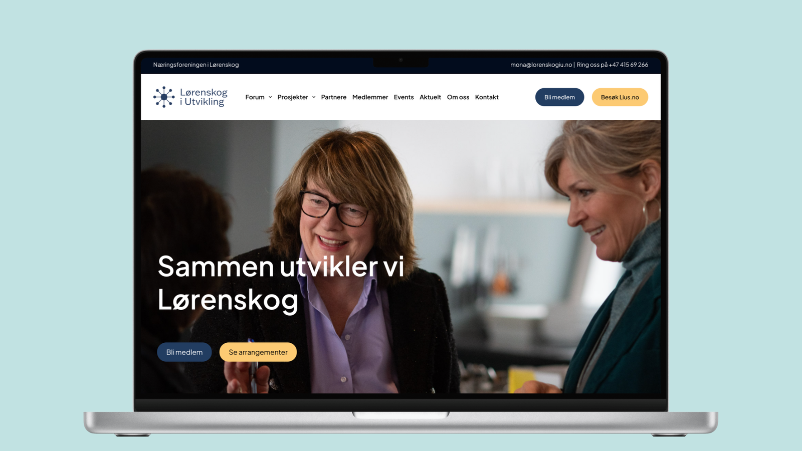 Forsiden av lorenskogiutvikling.no vist på en laptop, med overskriften «Sammen utvikler vi Lørenskog» over et foto av to kvinner i samtale, og knappene «Bli medlem» og «Se arrangementer».